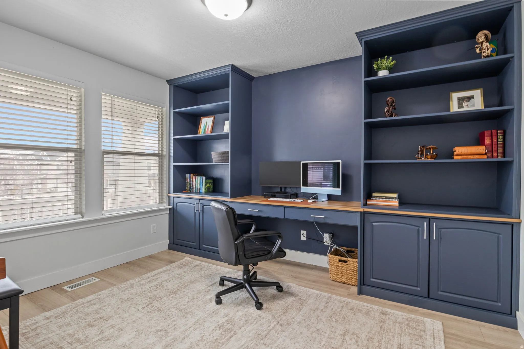 Office is located at the front of the house next to the entry, also features french glass doors for more privacy.