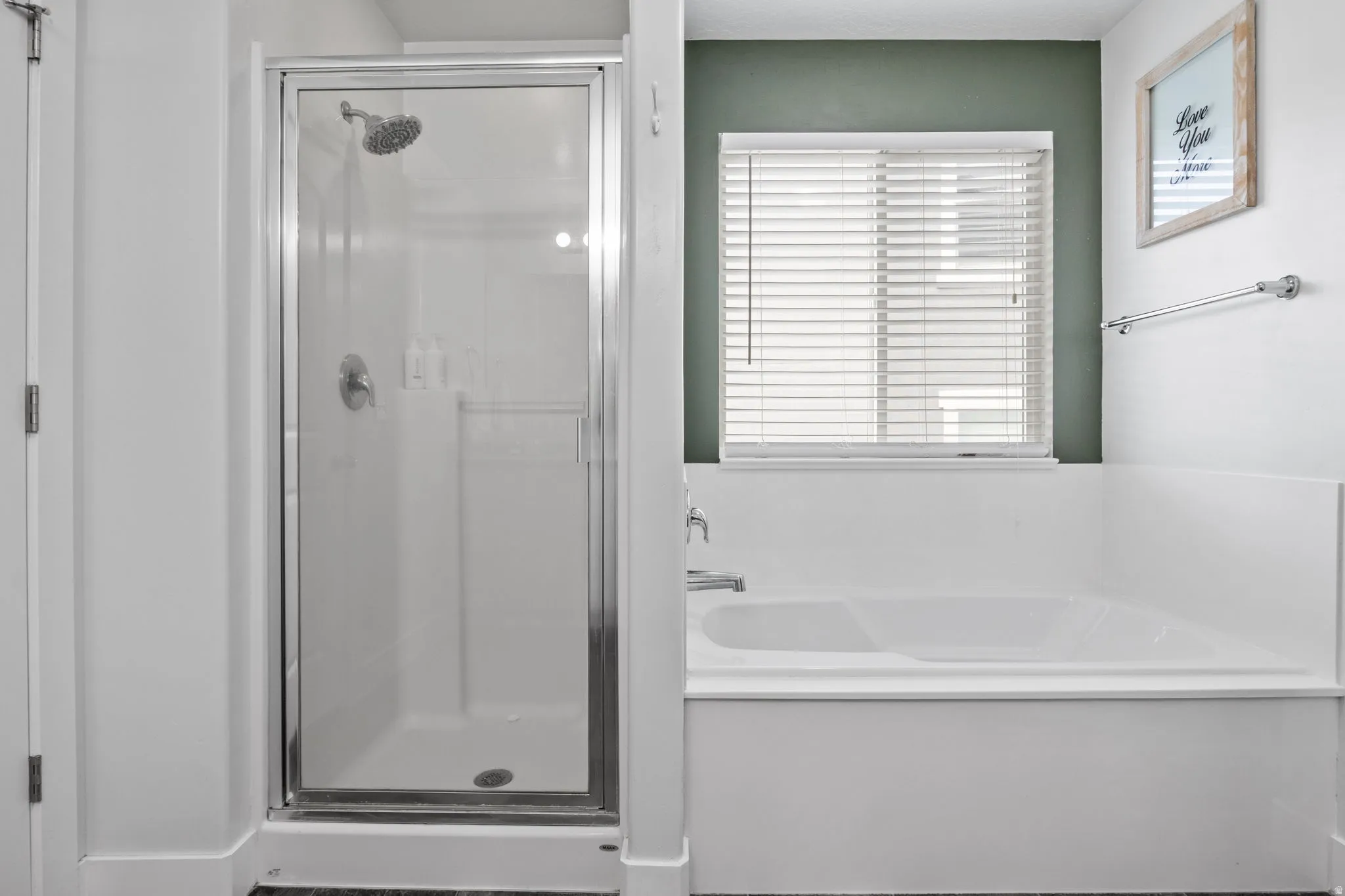 Primary bathroom with separate tub and shower