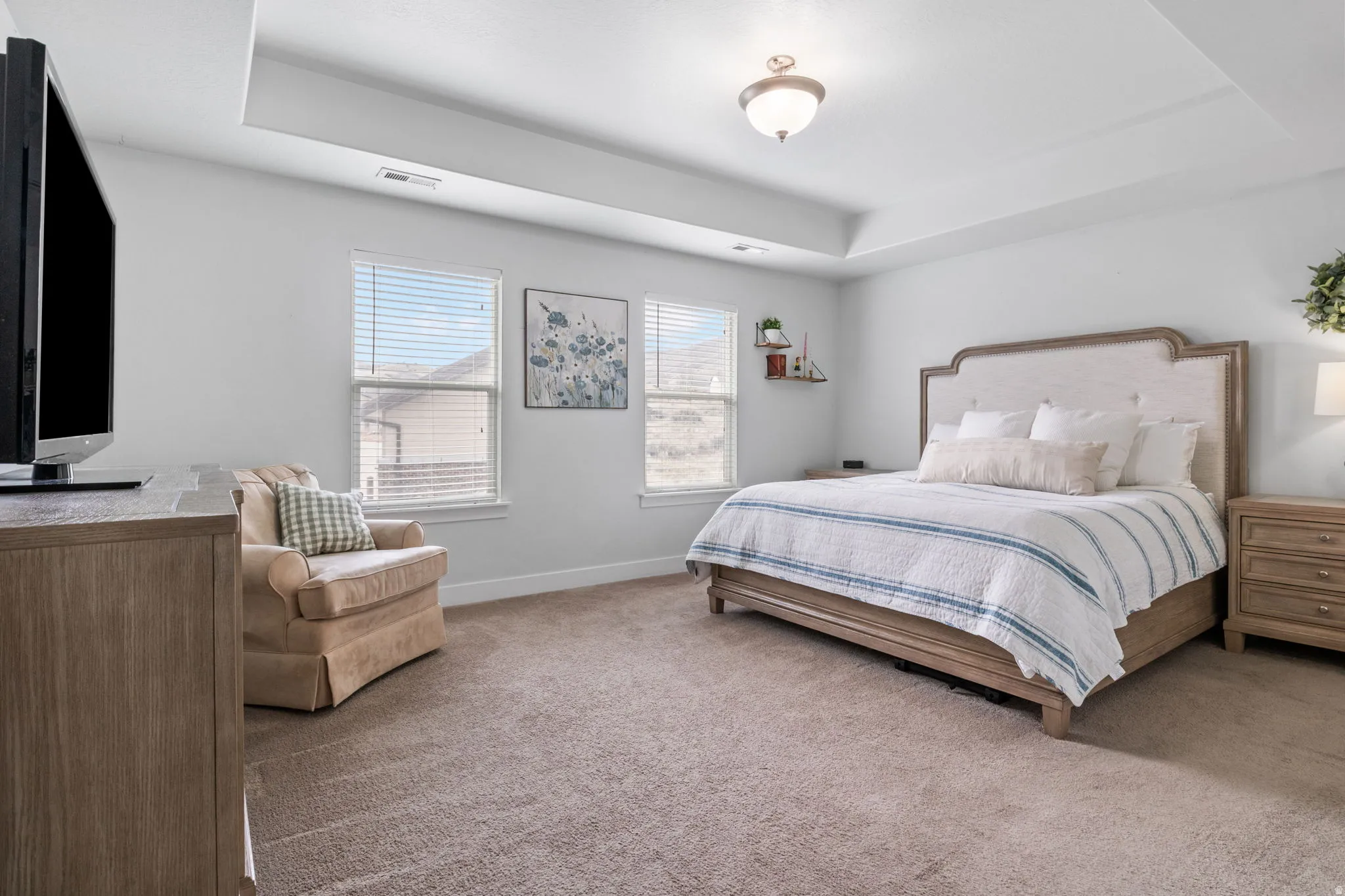 Large primary room with en suite that has separate tub and shower and large walk in closet.