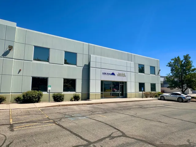 View of commercial location featuring uncovered parking