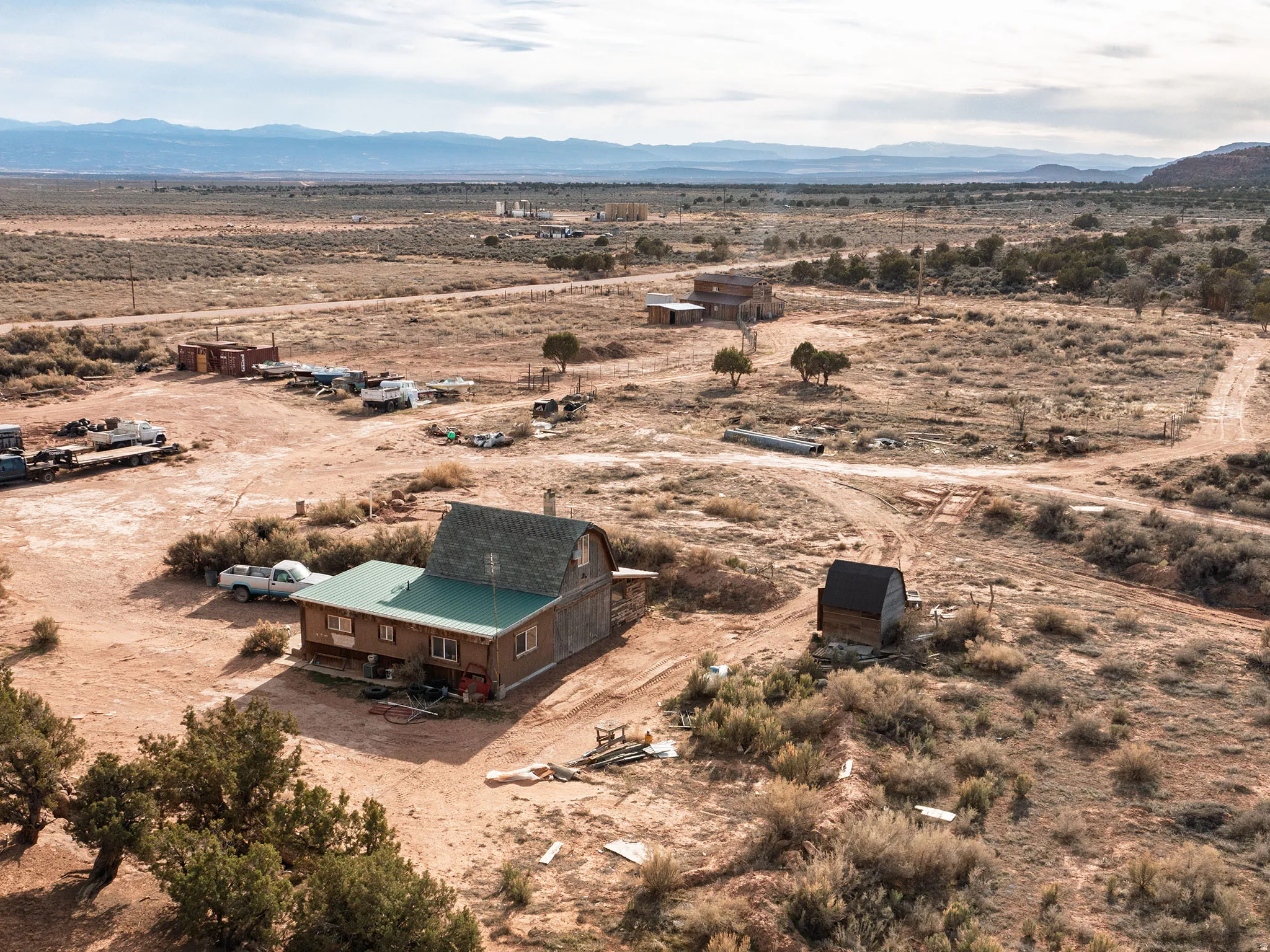 Aerial overview of property's location with rural landscape and a mountain backdrop