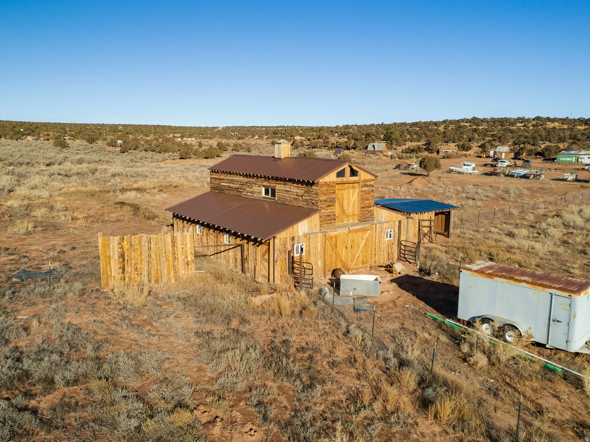 View of barn featuring a view of rural / pastoral area and view of desert