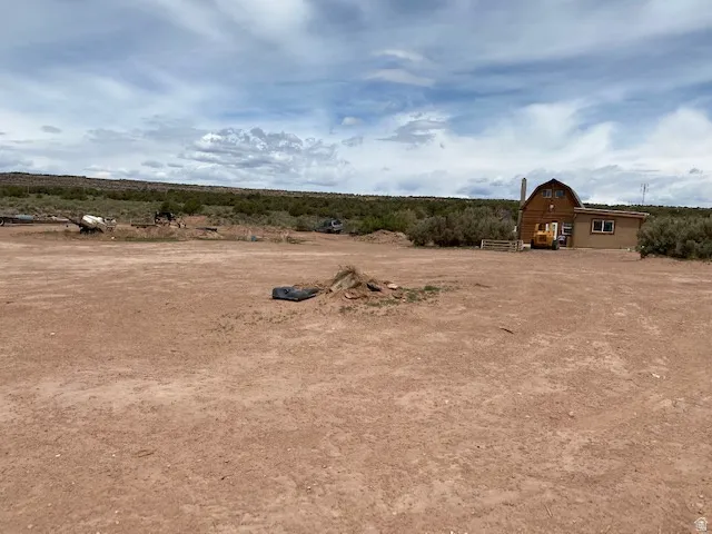 View of yard with a view of rural / pastoral area and a barn