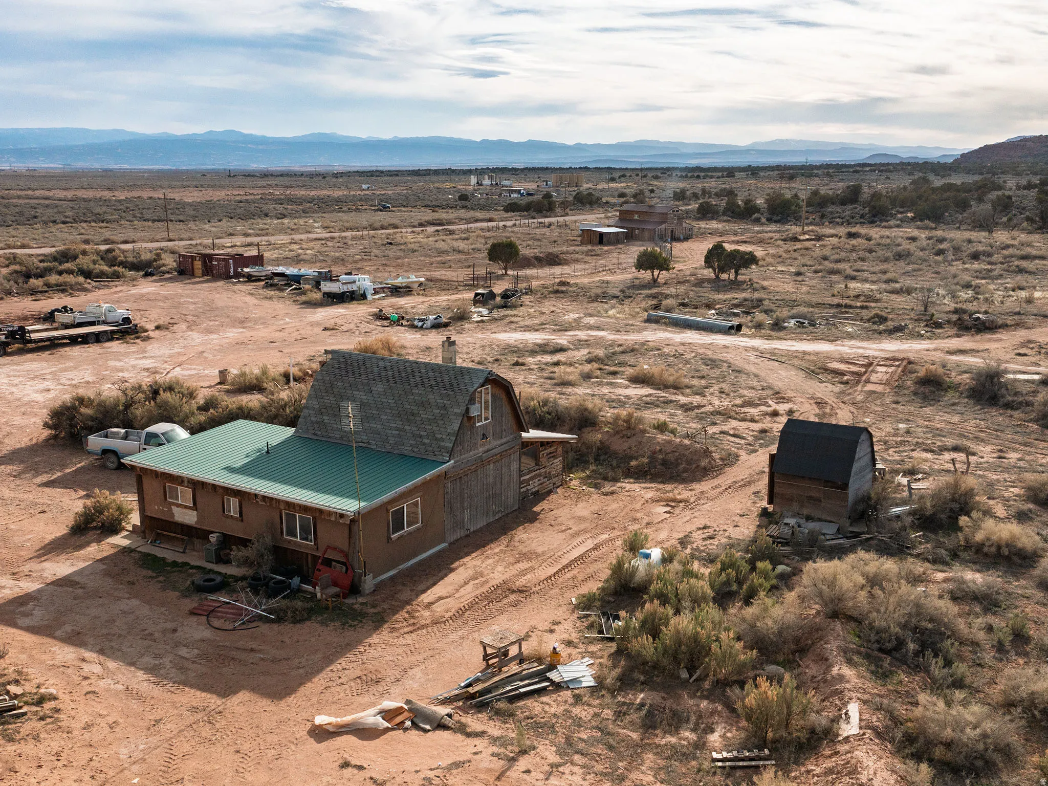 Overview of rural landscape featuring a mountainous background