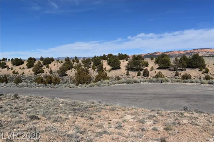 View of mountain backdrop with rural landscape and a desert landscape