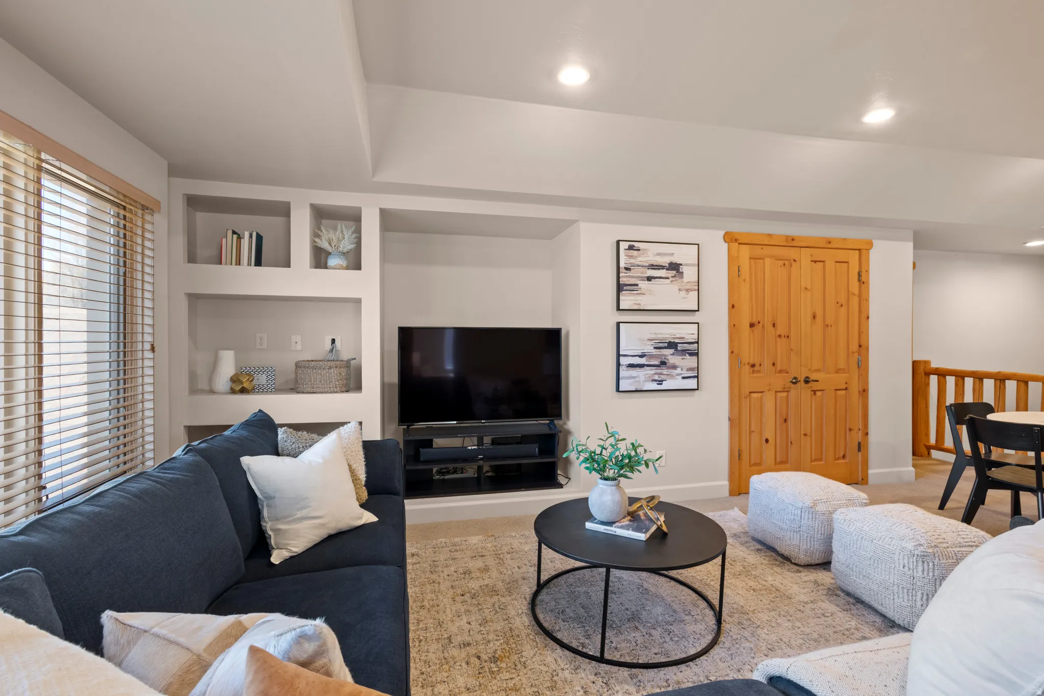 Spacious family room upstairs with built-ins