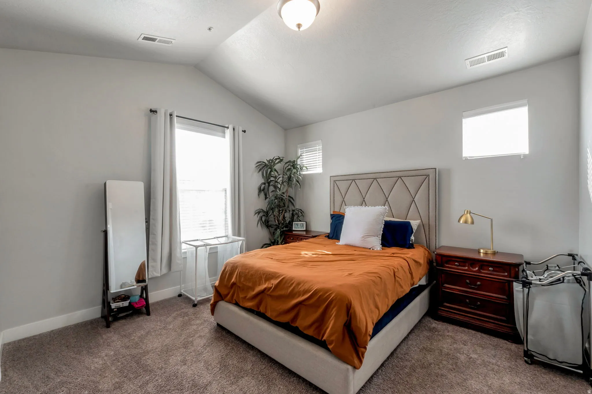 Carpeted bedroom with baseboards