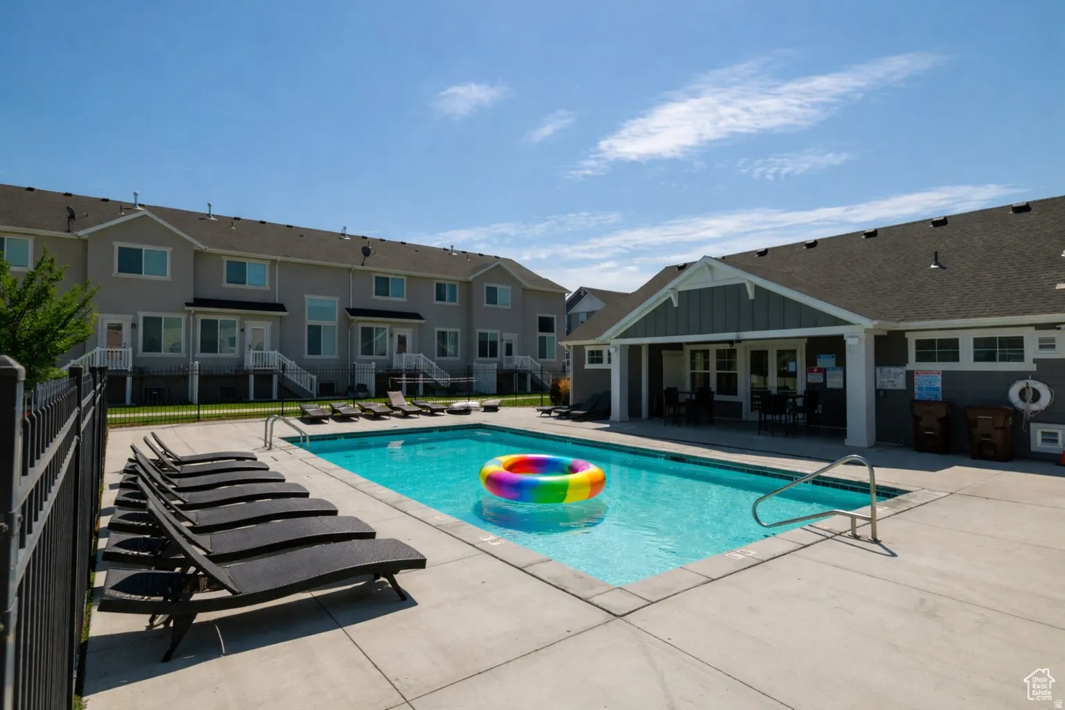 Community pool with a patio