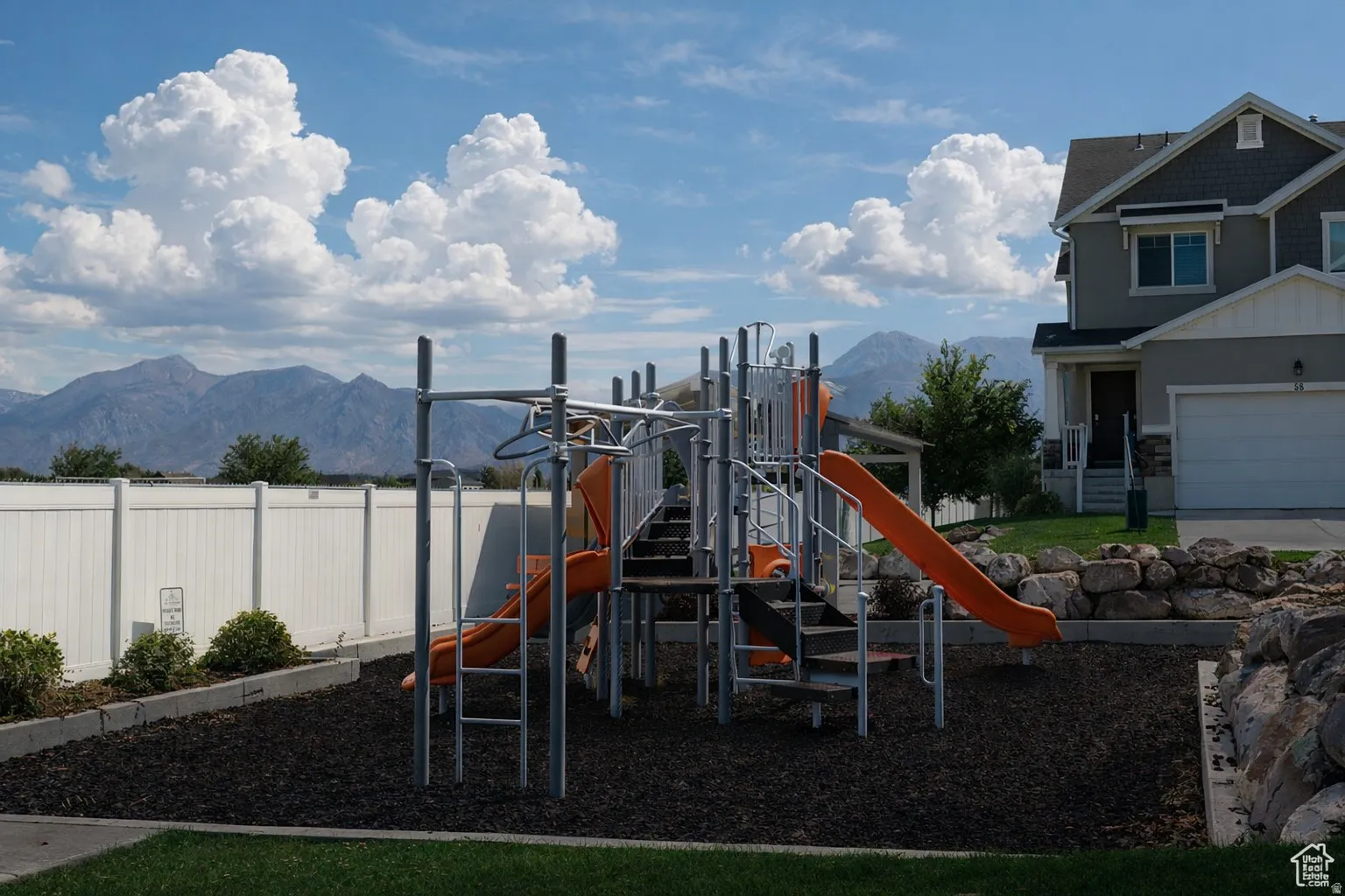 Community playground with a mountain view