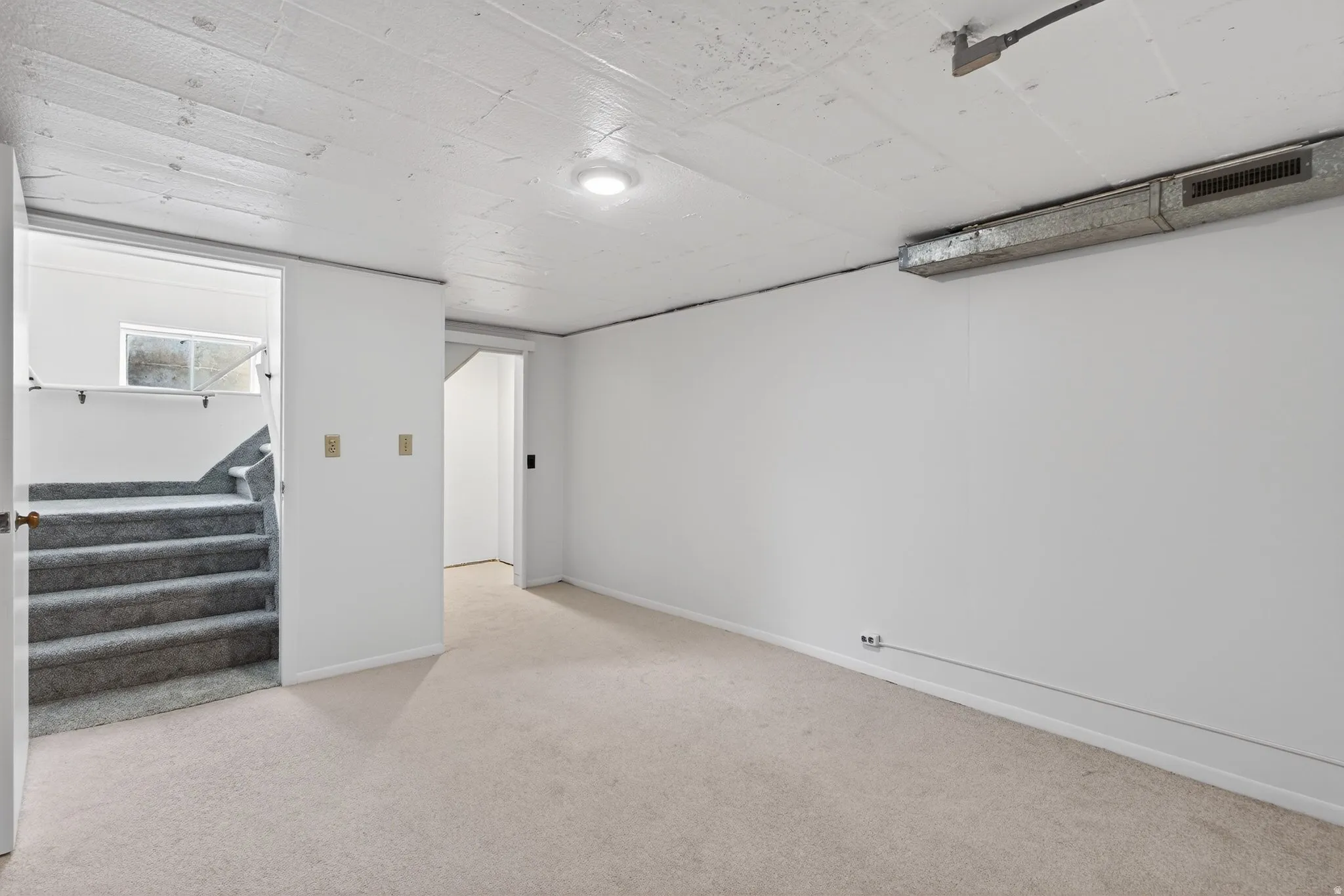 Below grade flex-room with a closet. This space is ideally suited for storage, a hobby room or a future bedroom (buyer to verify city requirements).