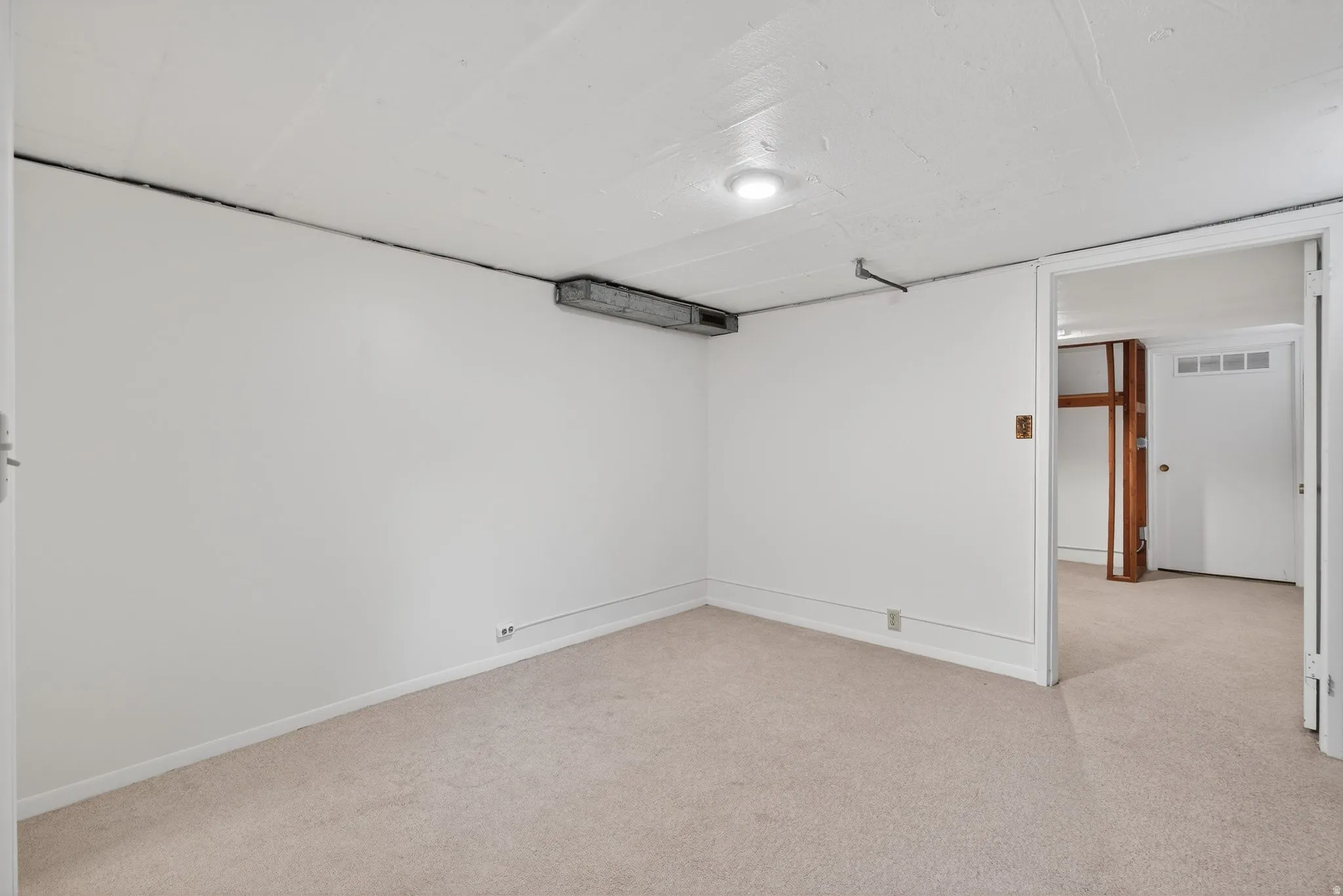 Below grade flex-room with a closet. This space is ideally suited for storage, a hobby room or a future bedroom (buyer to verify city requirements).