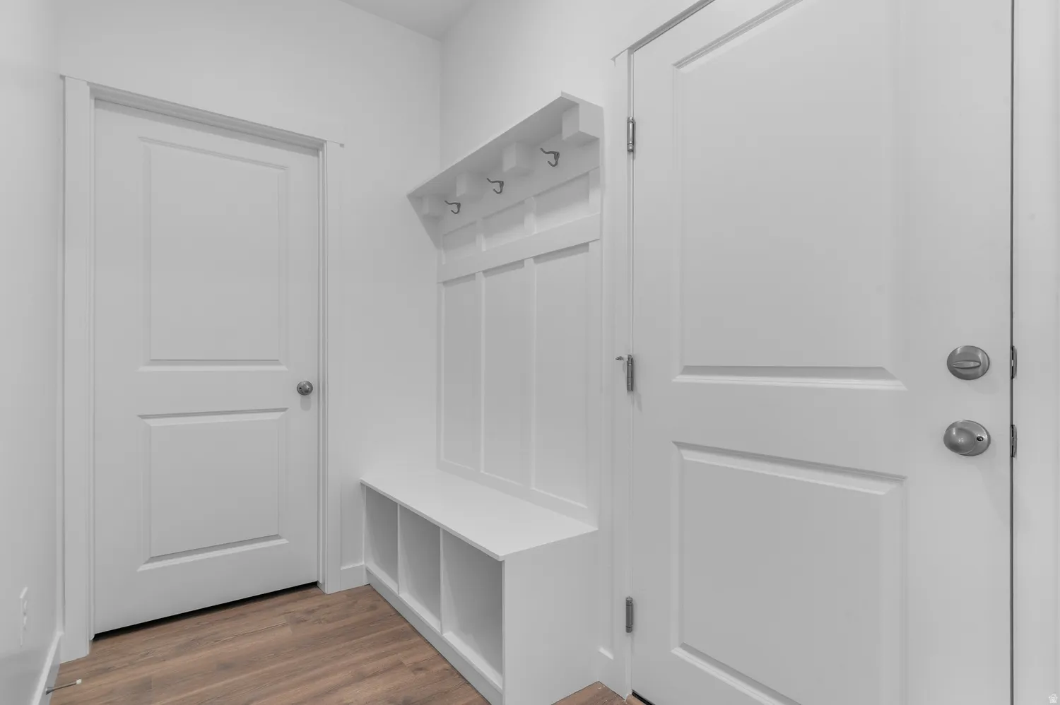 Mudroom featuring dark wood-type flooring