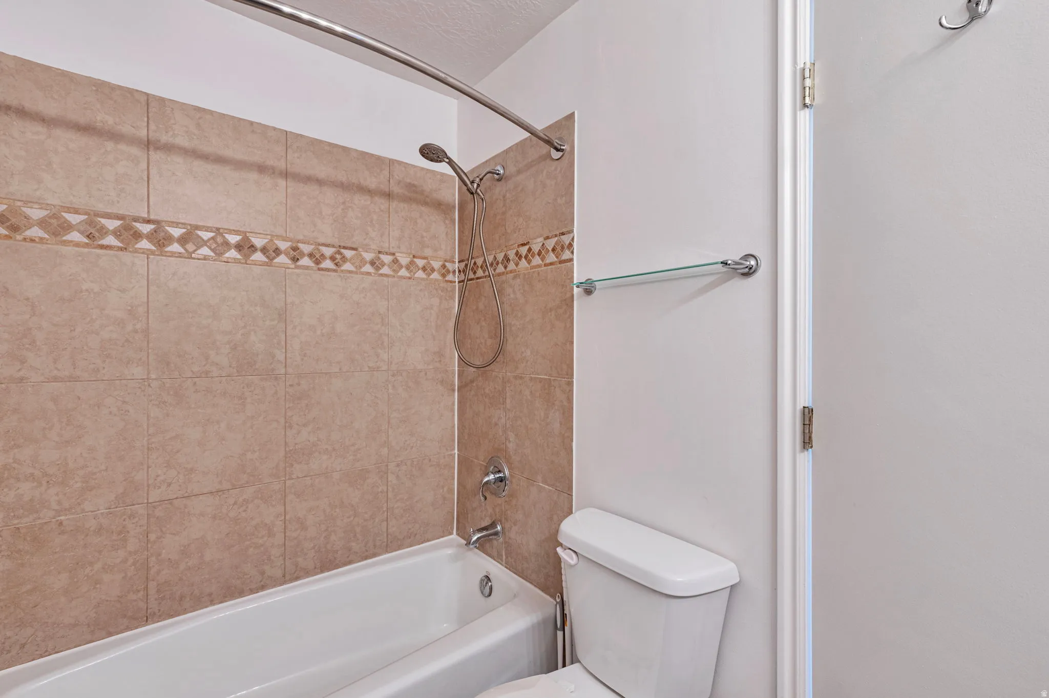 Full bath with shower / bath combination and toilet