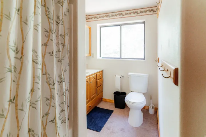 Full bathroom with a shower with curtain and vanity