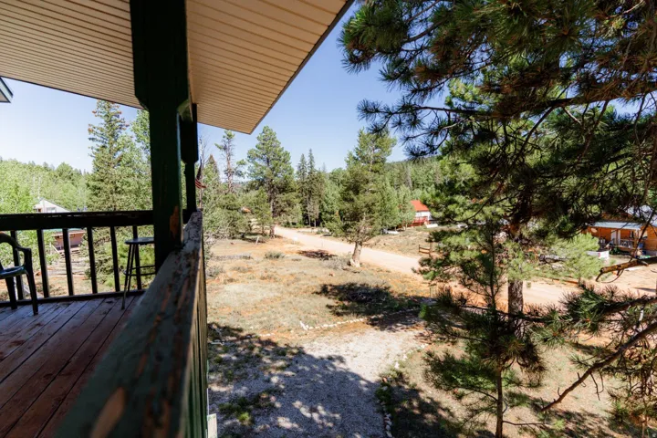 View of yard with a balcony