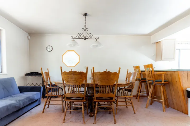Dining room featuring light colored carpet