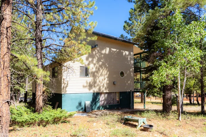 View of side of home with a balcony