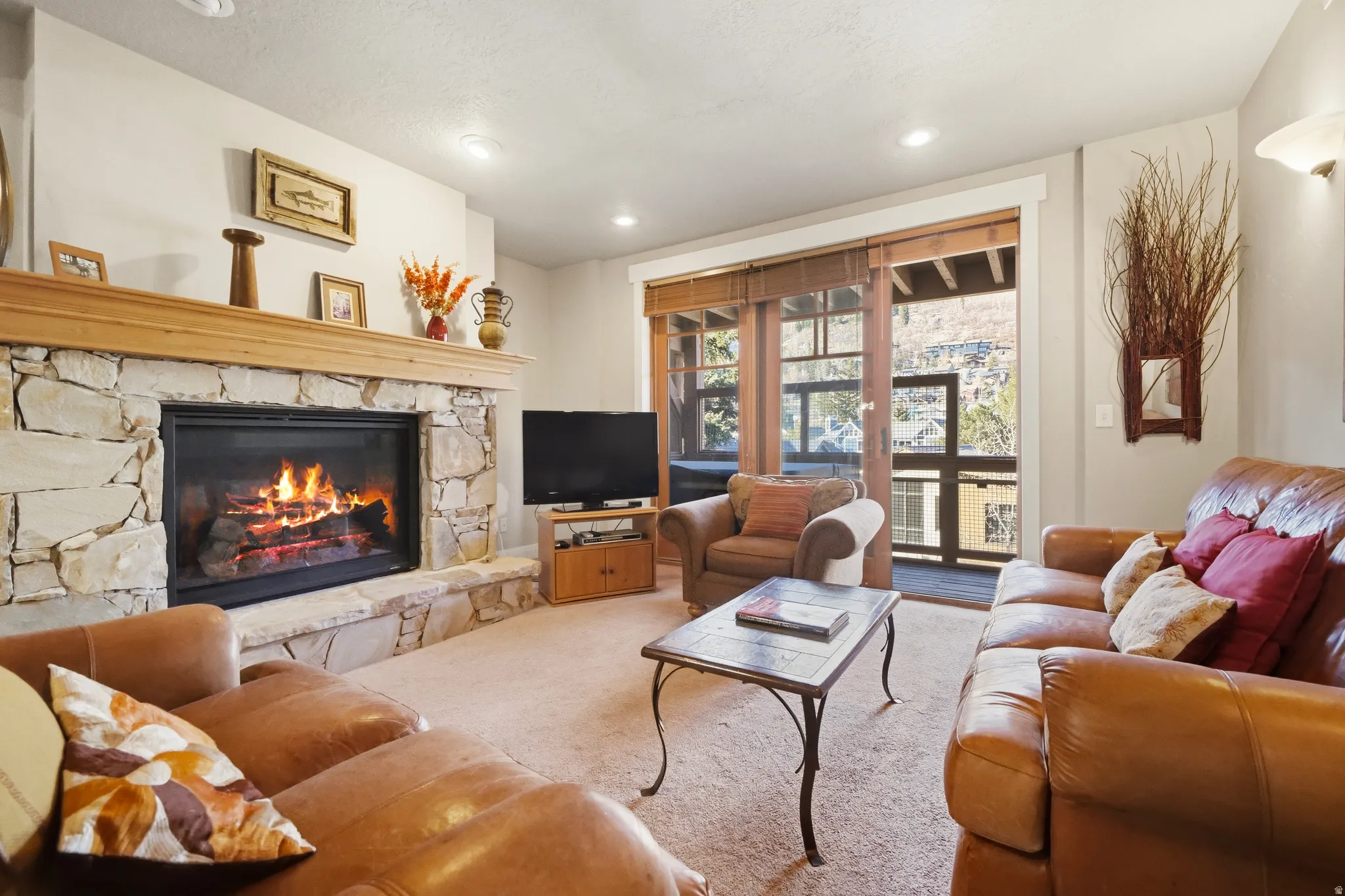 Hand-Selected Brown's Canyon Stone fireplace and recessed lighting