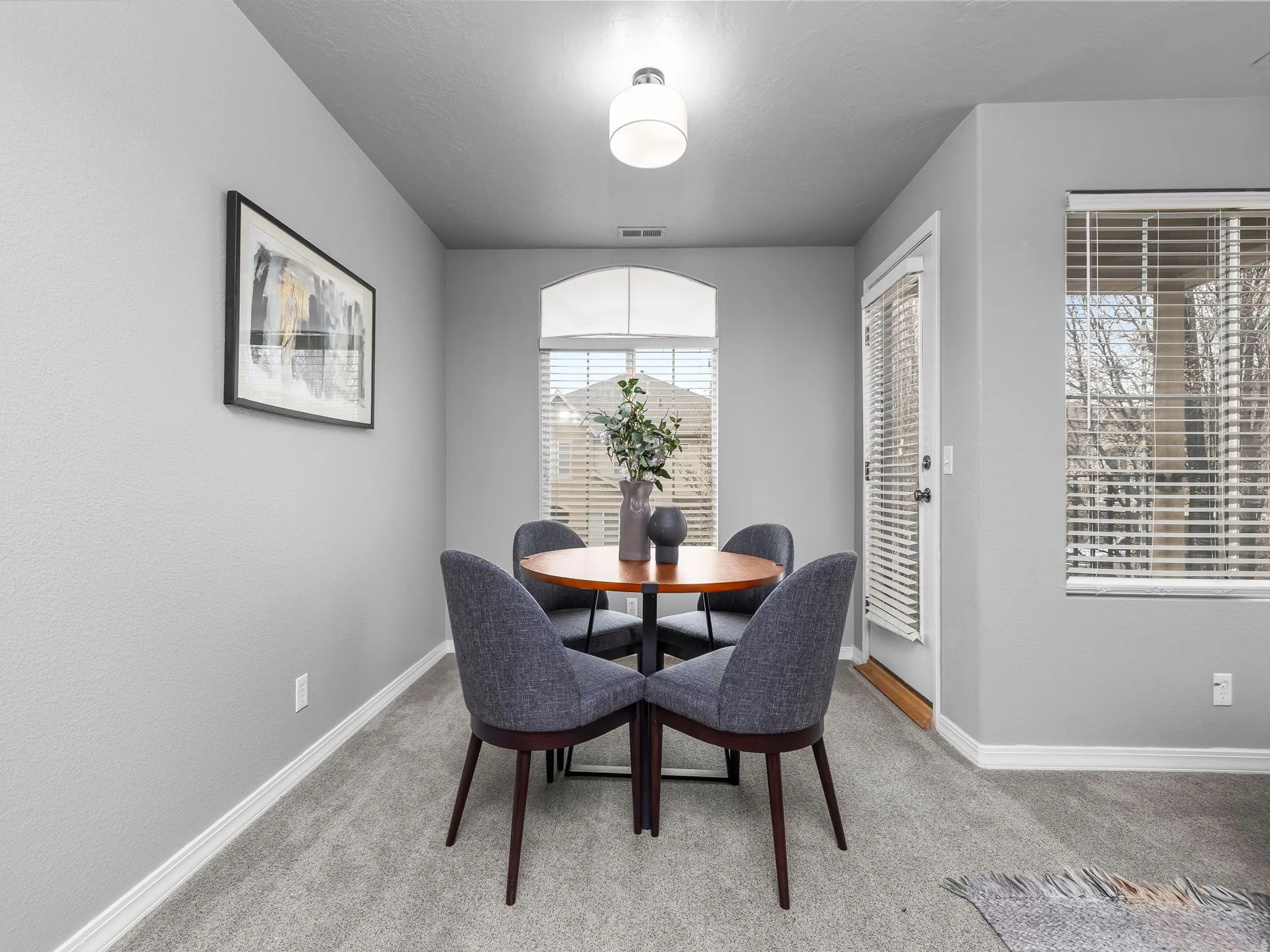 Dining space featuring carpet and baseboards