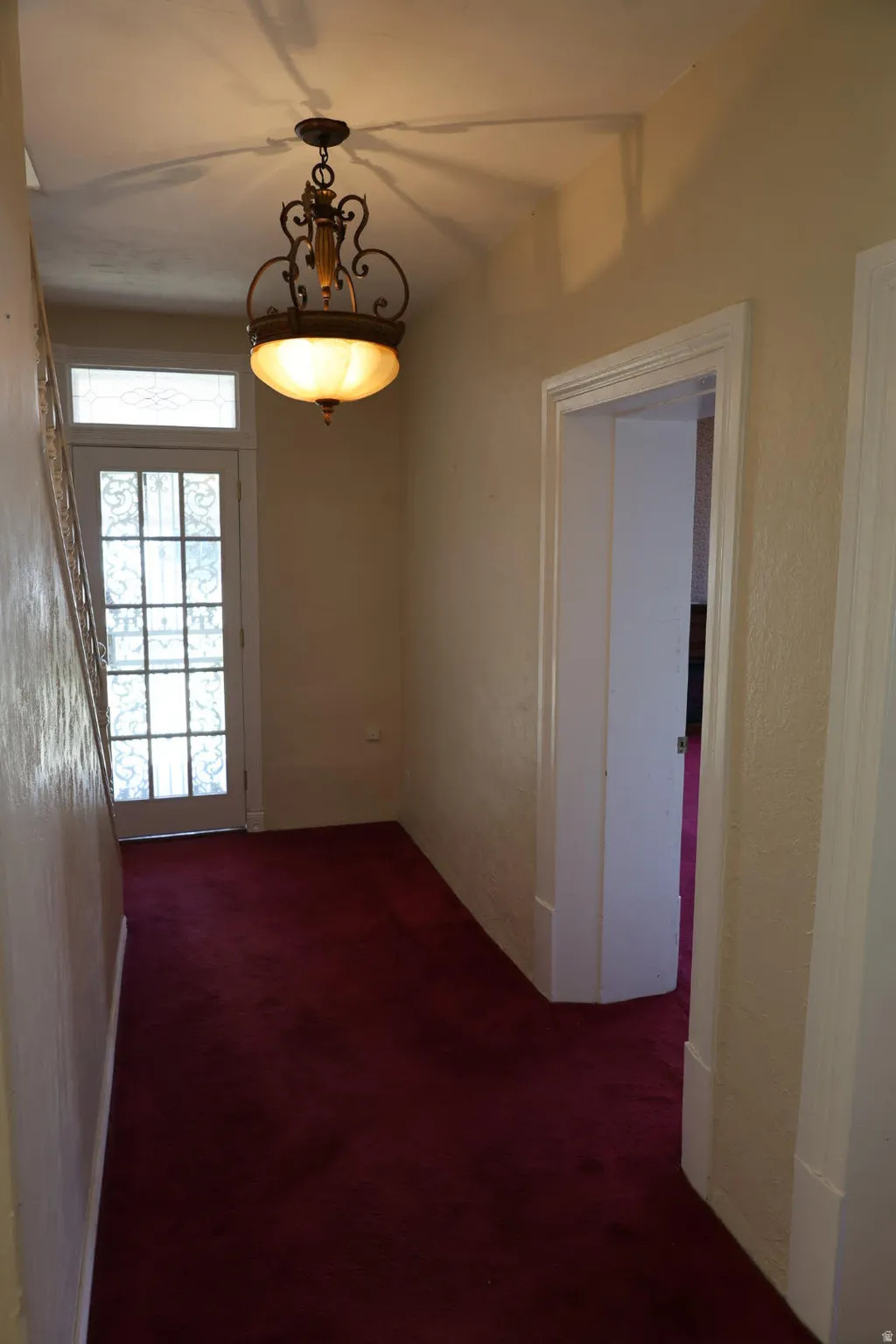 Hall with dark carpet