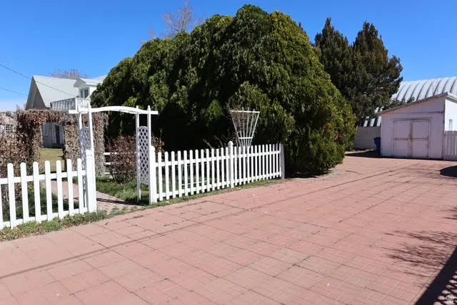 View of front facade with a storage shed
