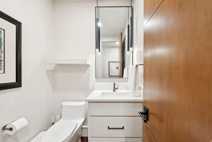 Half bathroom with toilet and vanity