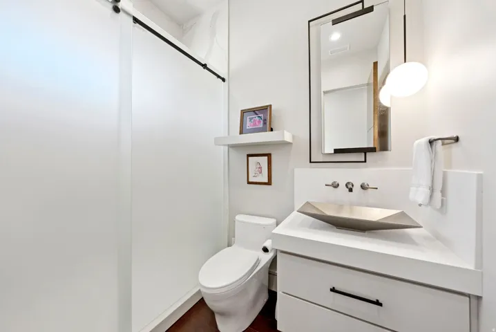 Bathroom with vanity and dark wood finished floors