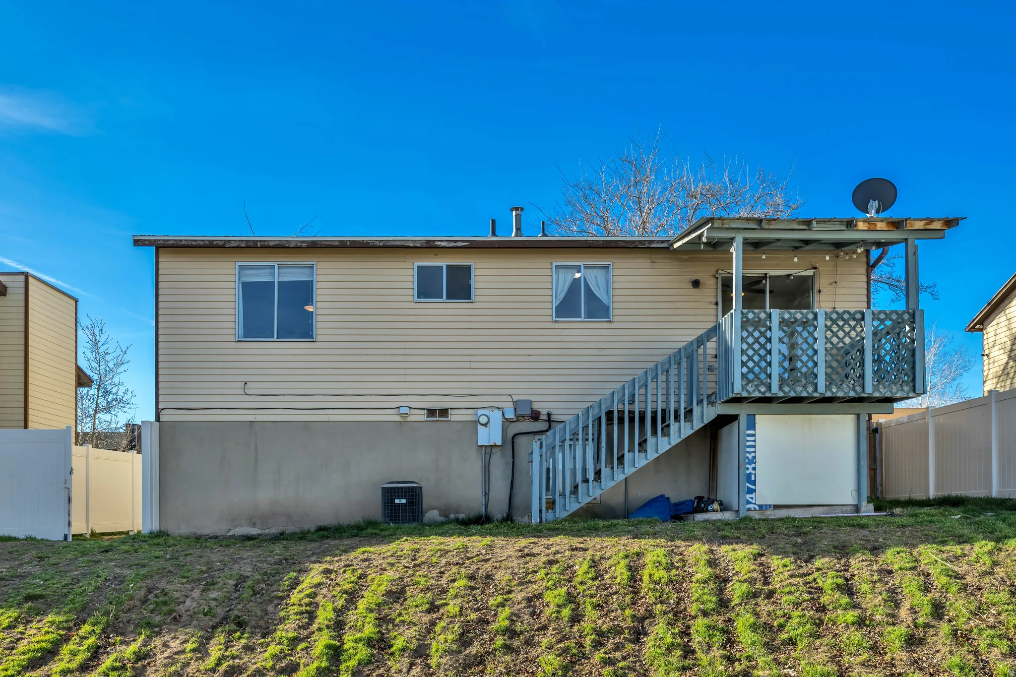 Back of house with stairway