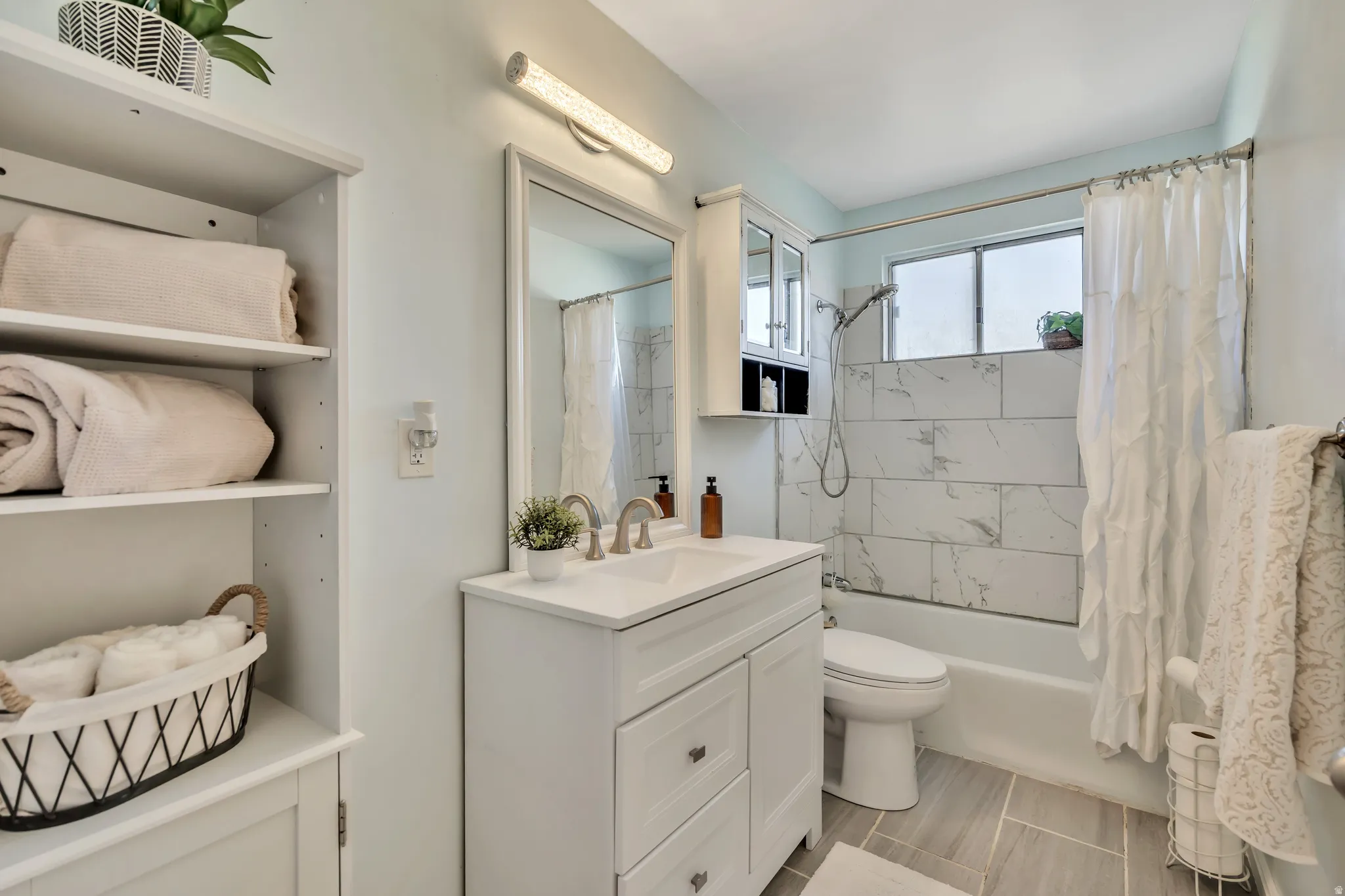 Full bathroom featuring vanity and shower / bath combo