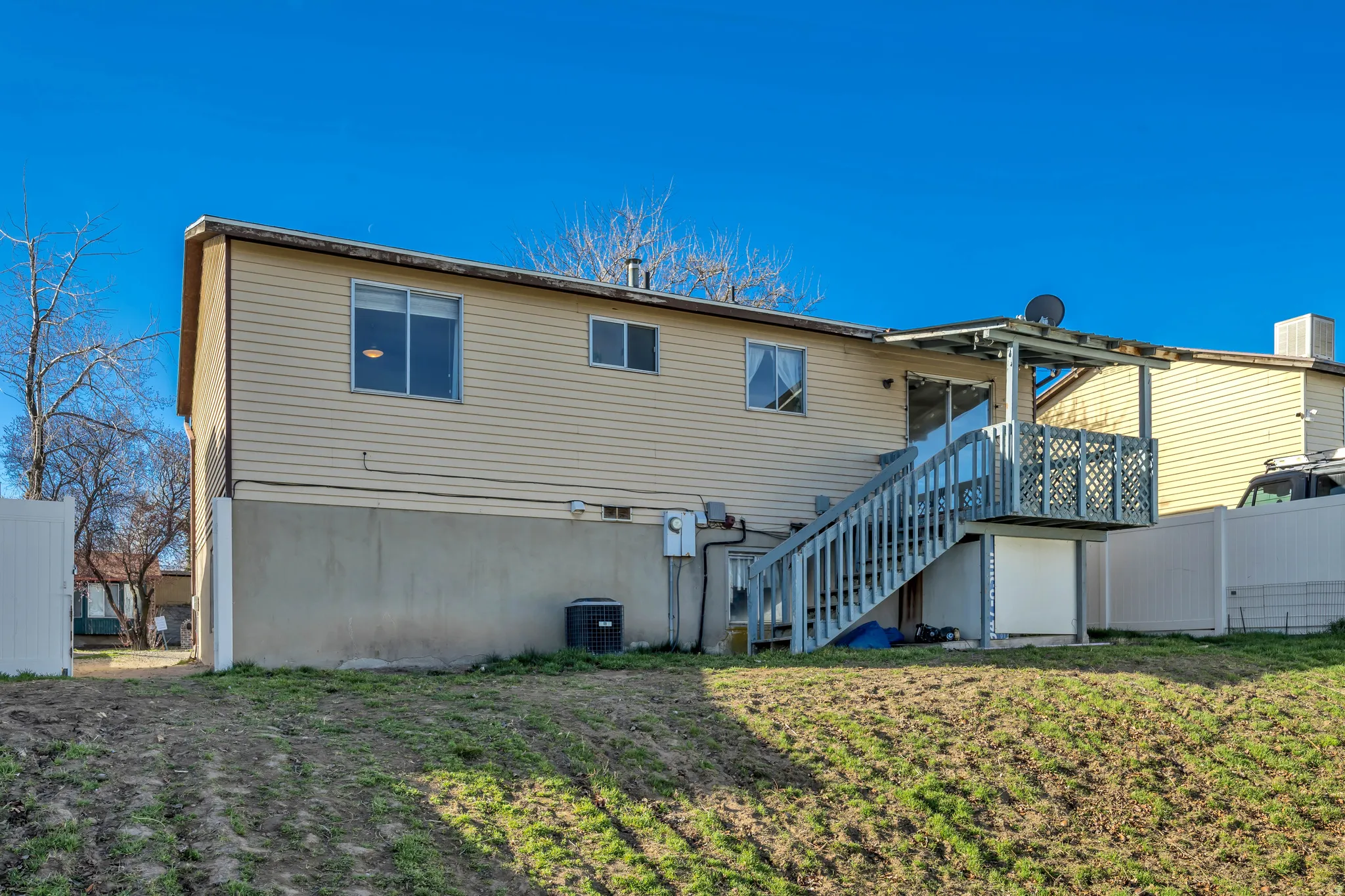 Rear view of property with stairs