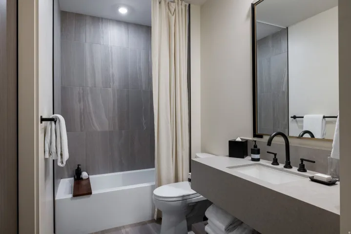 Full bathroom featuring vanity and shower / bath combo with shower curtain