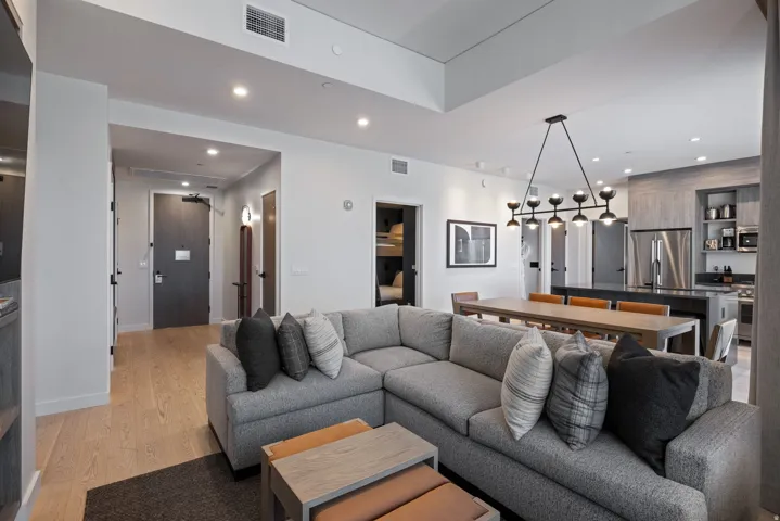 Living room with recessed lighting and light wood-style floors