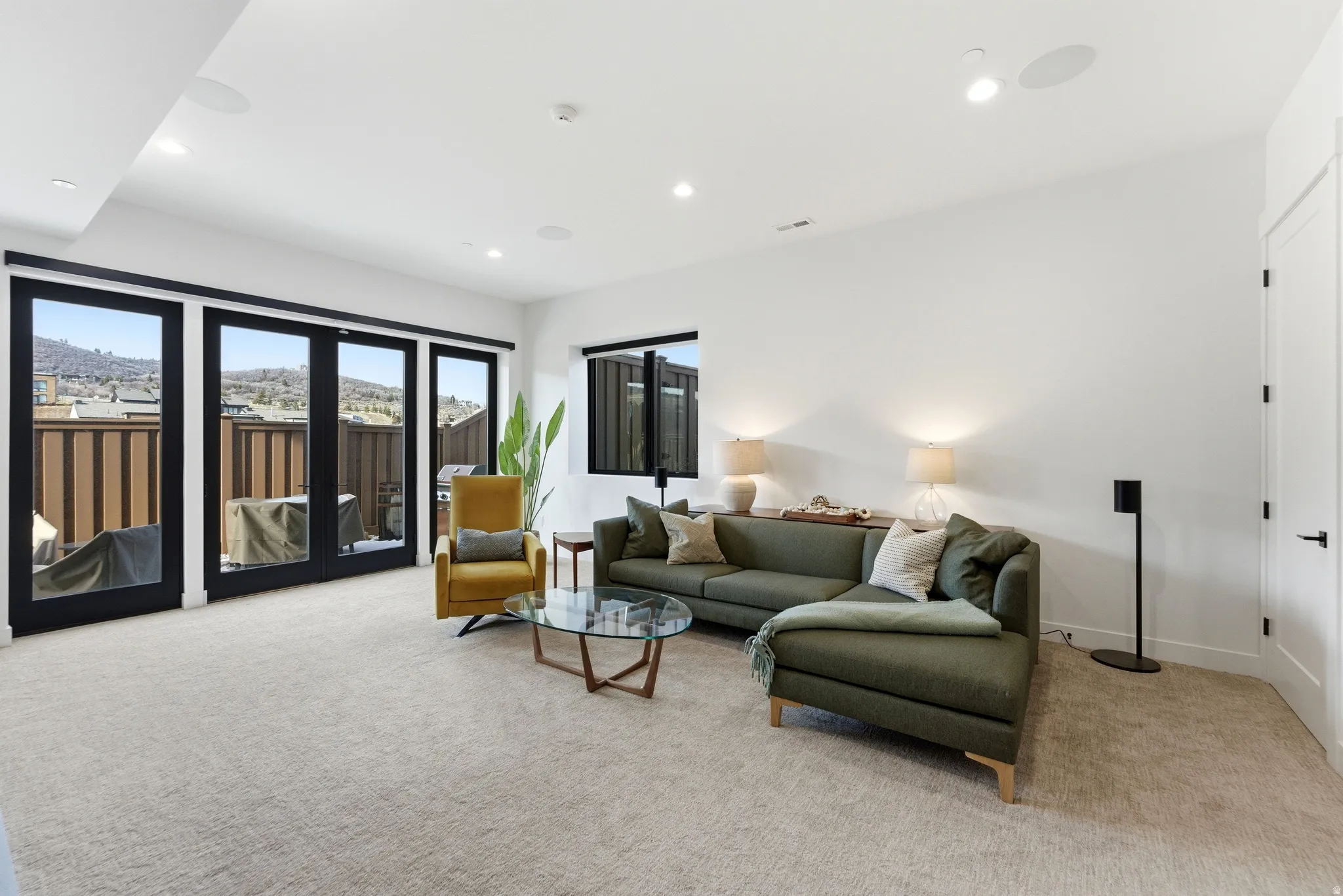 Living room featuring light carpet and recessed lighting