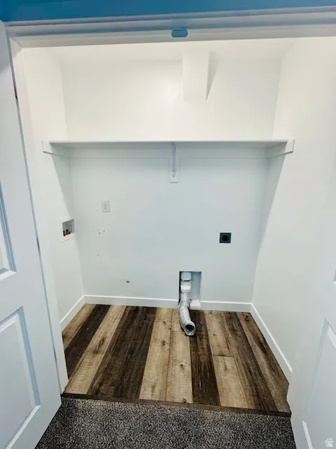Laundry area featuring washer hookup, dark wood finished floors, and electric dryer hookup