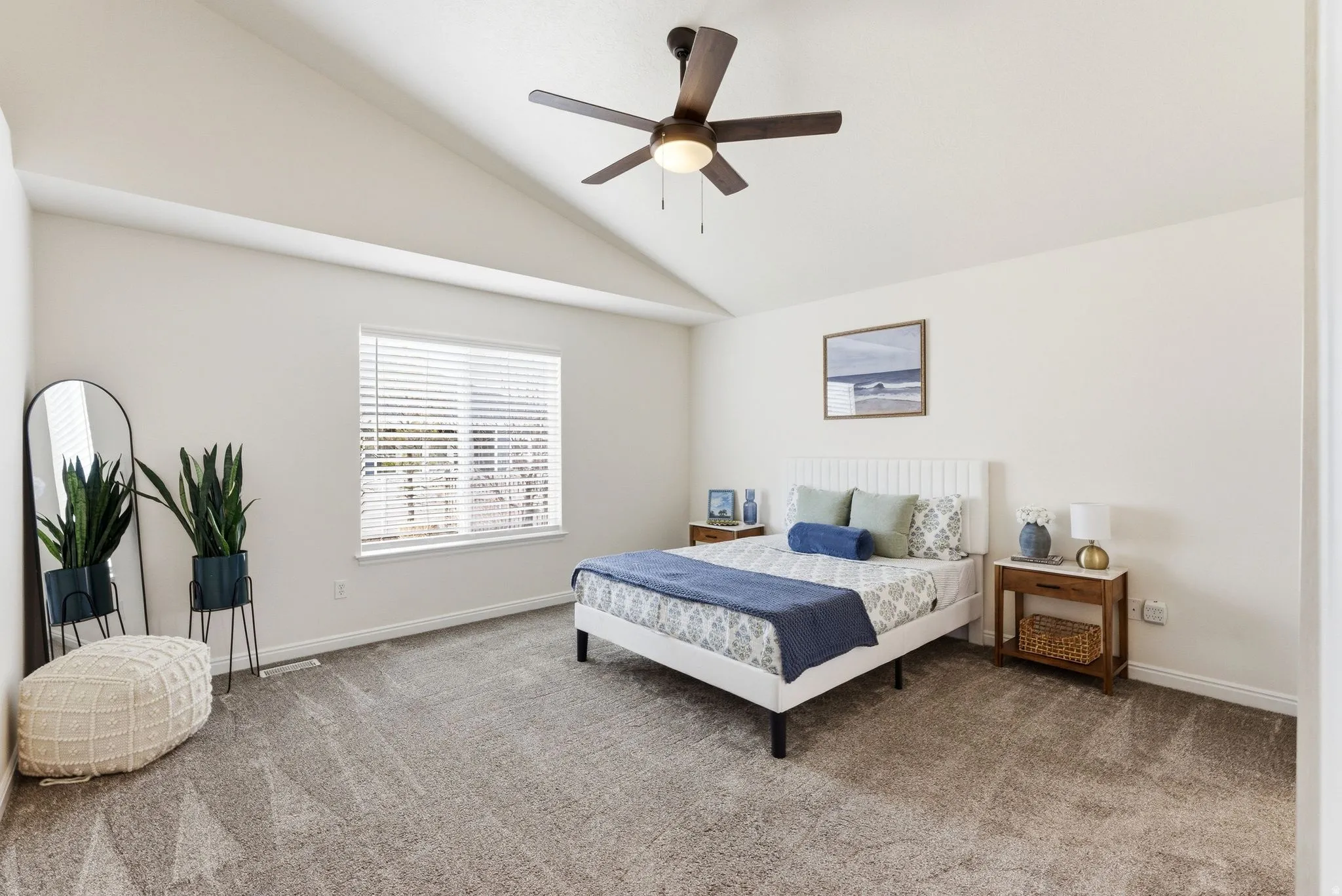Bedroom featuring lofted ceiling, carpet flooring, and ceiling fan