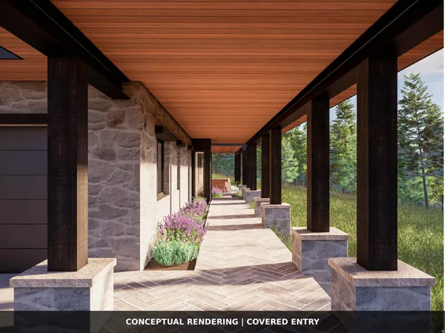 Covered entry featuring a wood-finish ceiling, stone veneer exterior, dark wood-finish columns, a herringbone paver walkway, and integrated landscaping