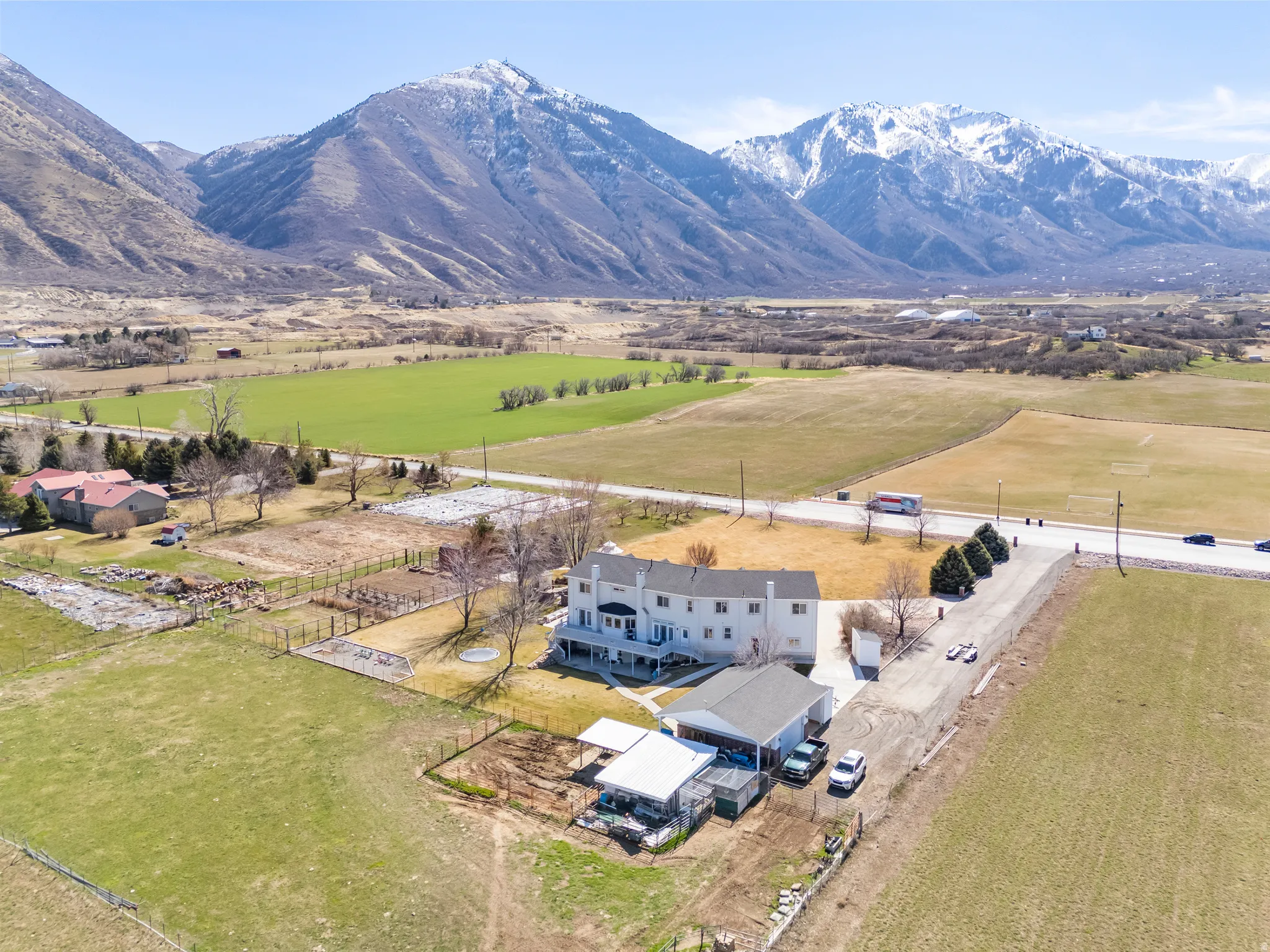 Overview of rural landscape featuring a mountainous background