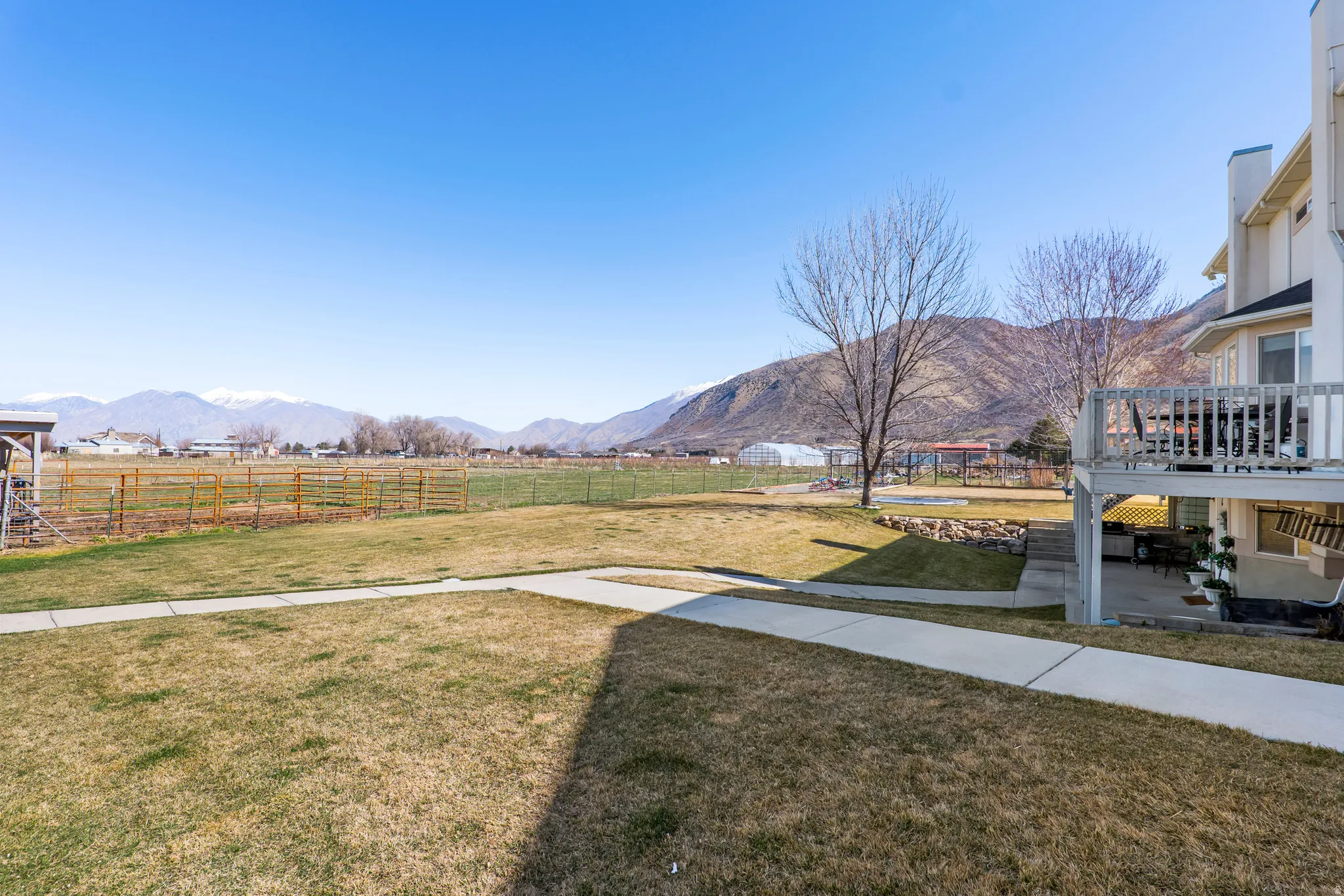 View of yard featuring a mountain view, a view of rural / pastoral area, and a patio
