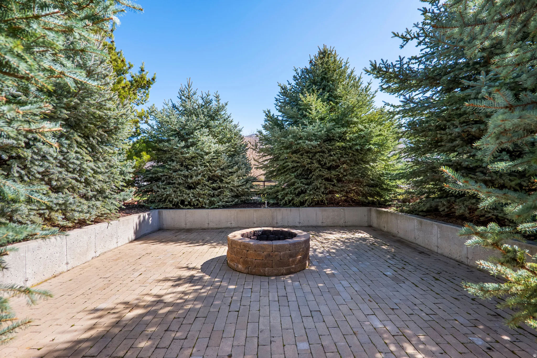 View of patio featuring a fire pit