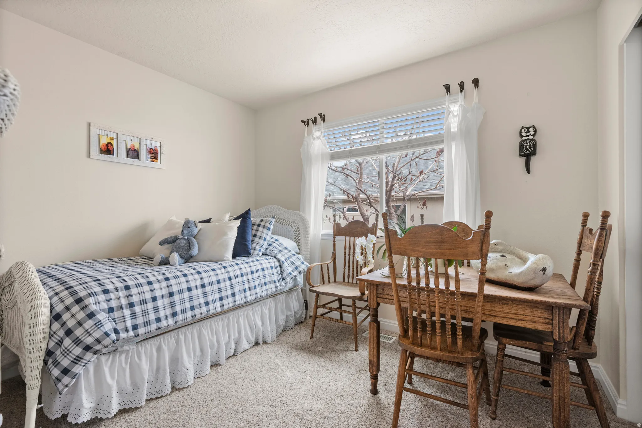 Bedroom featuring carpet floors and baseboards
