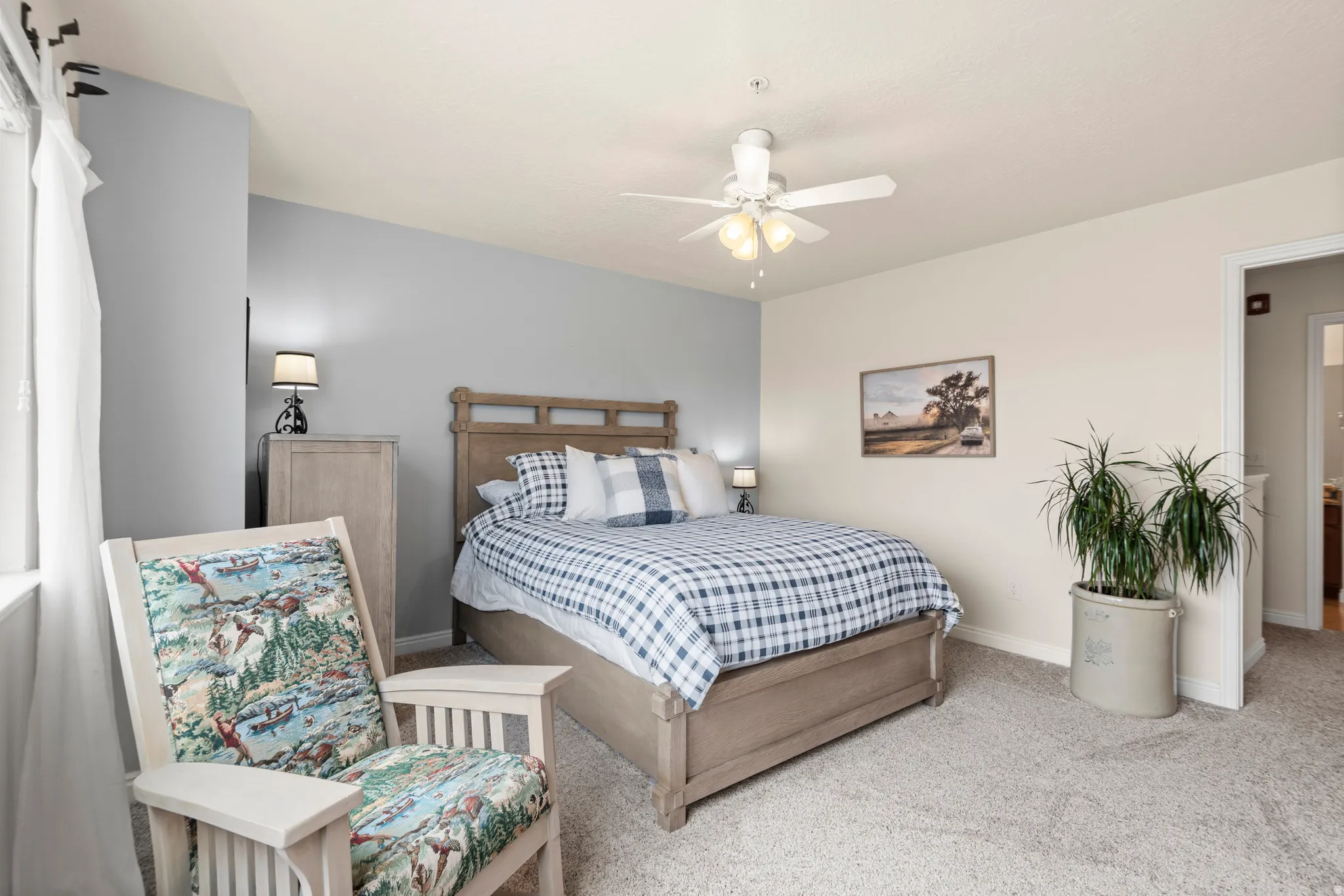 Bedroom featuring carpet and ceiling fan