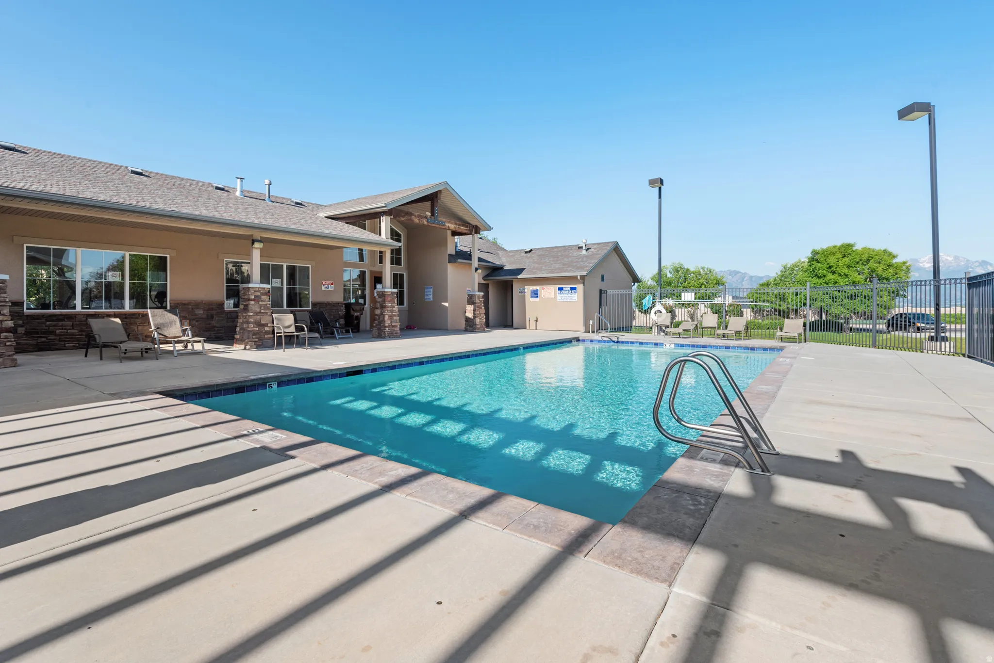 Community pool featuring a patio area
