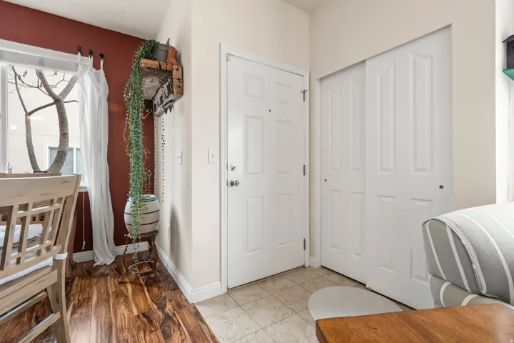 Foyer with light tile patterned floors and healthy amount of natural light