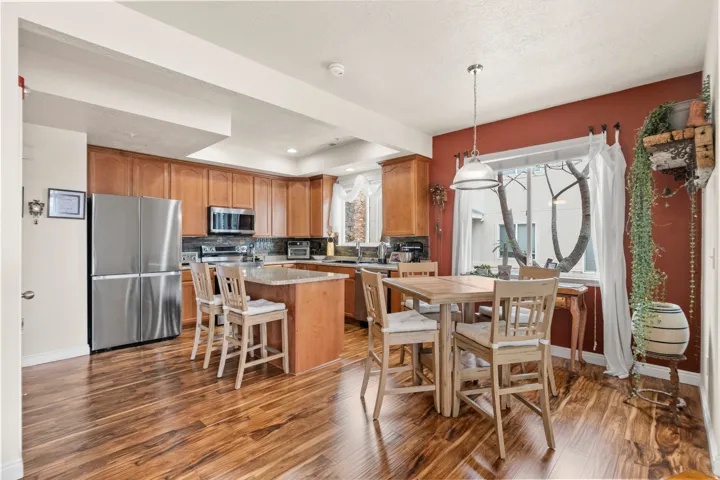 Dining space featuring dark wood finished floors and recessed lighting