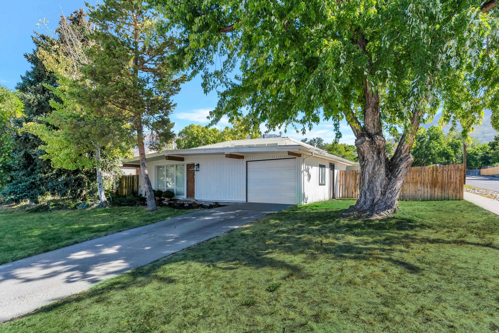 Ranch-style home with an attached garage and driveway