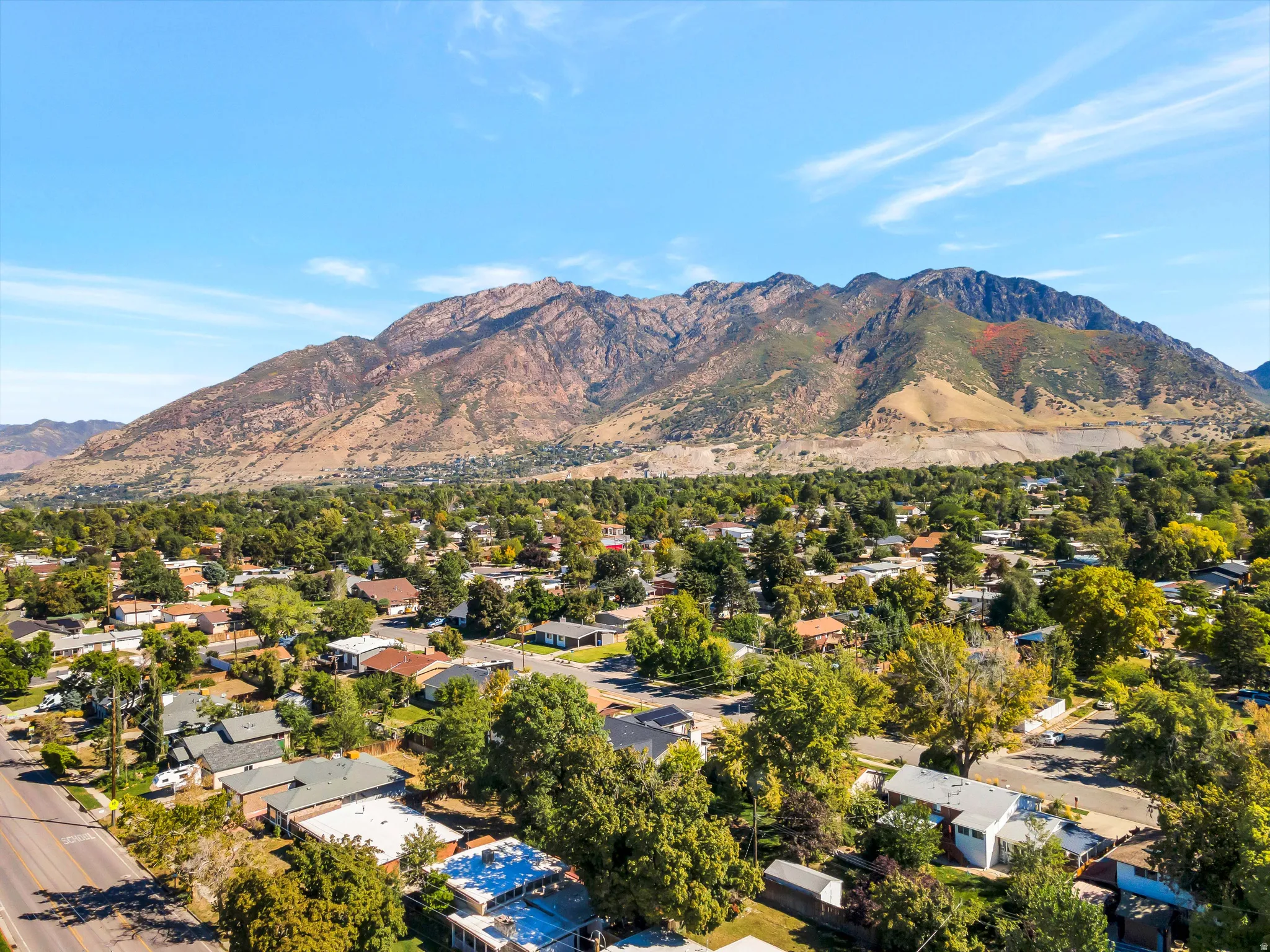 View of mountain background featuring nearby suburban area