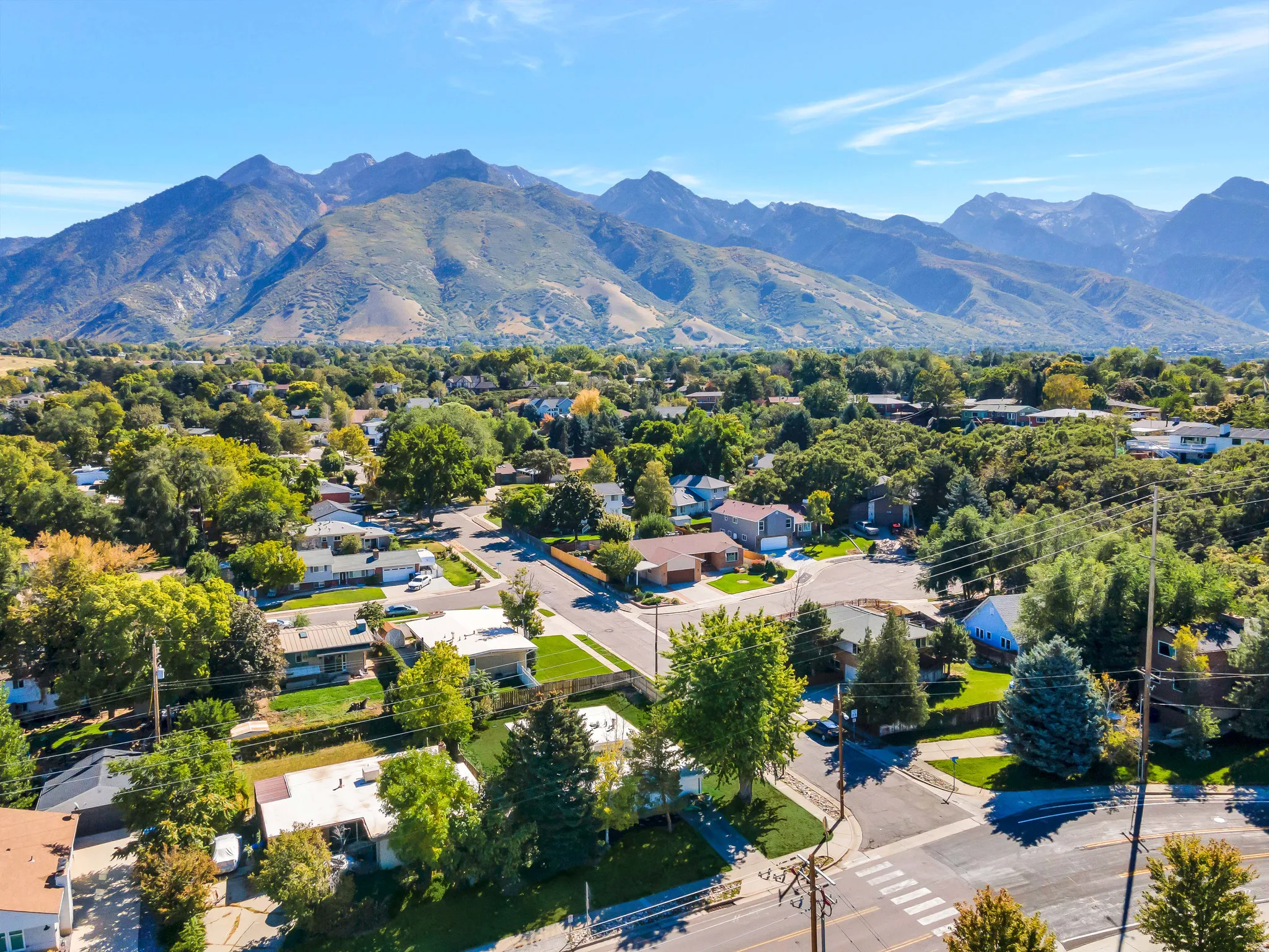 Aerial view of residential area featuring a mountainous background