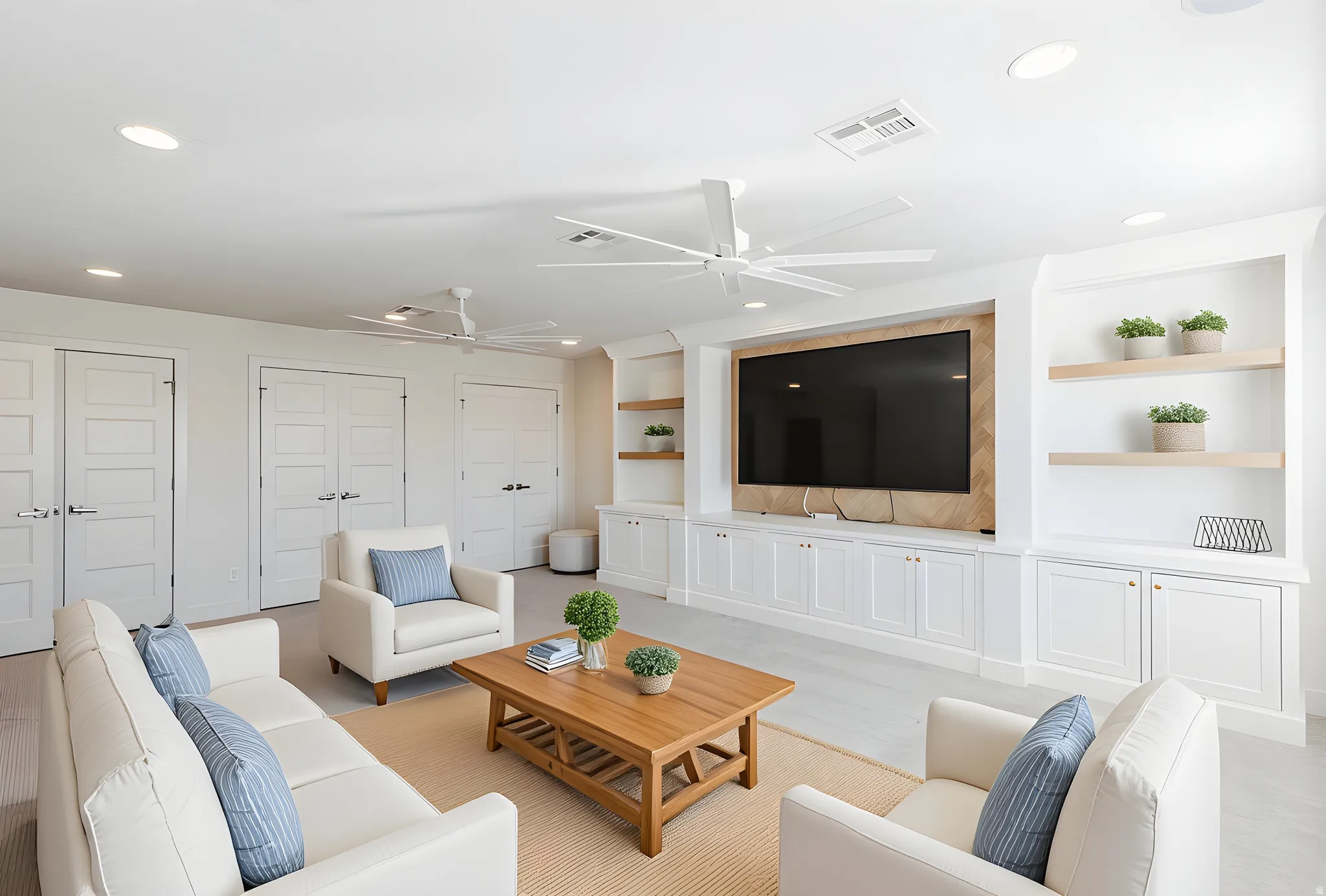 Living room featuring built in features, ceiling fan, and recessed lighting