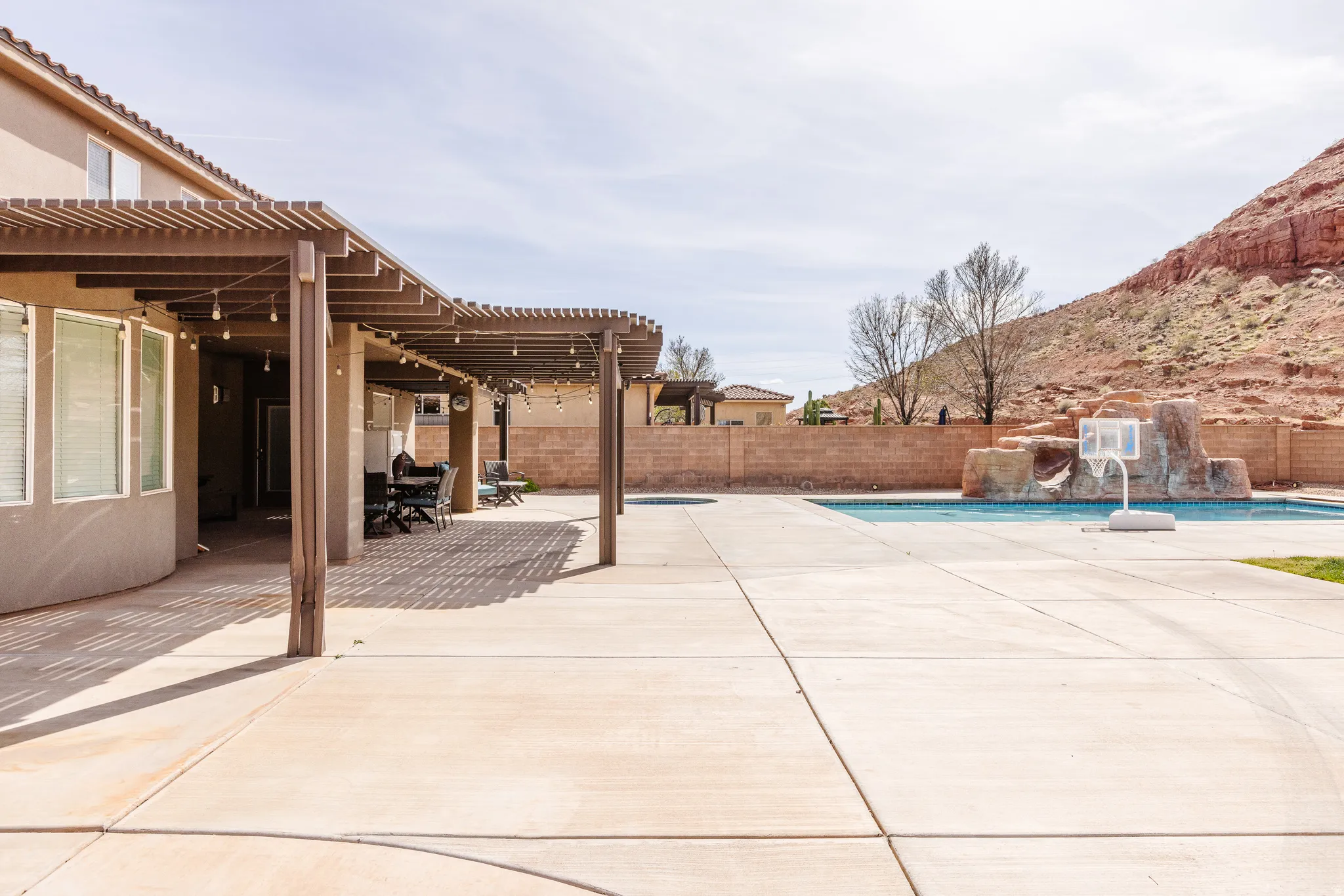 Fenced backyard with a patio area and a pergola