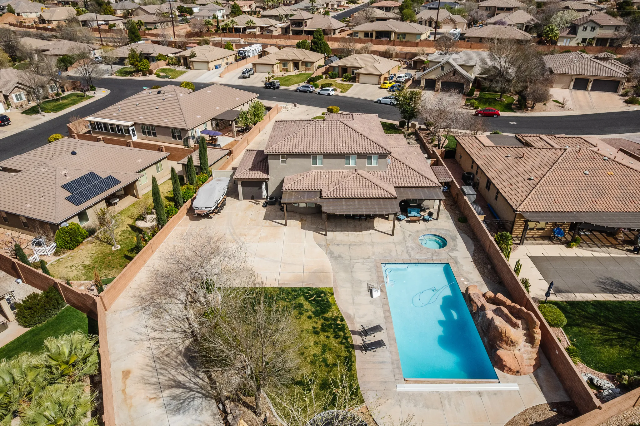 Aerial perspective of suburban area featuring a pool area